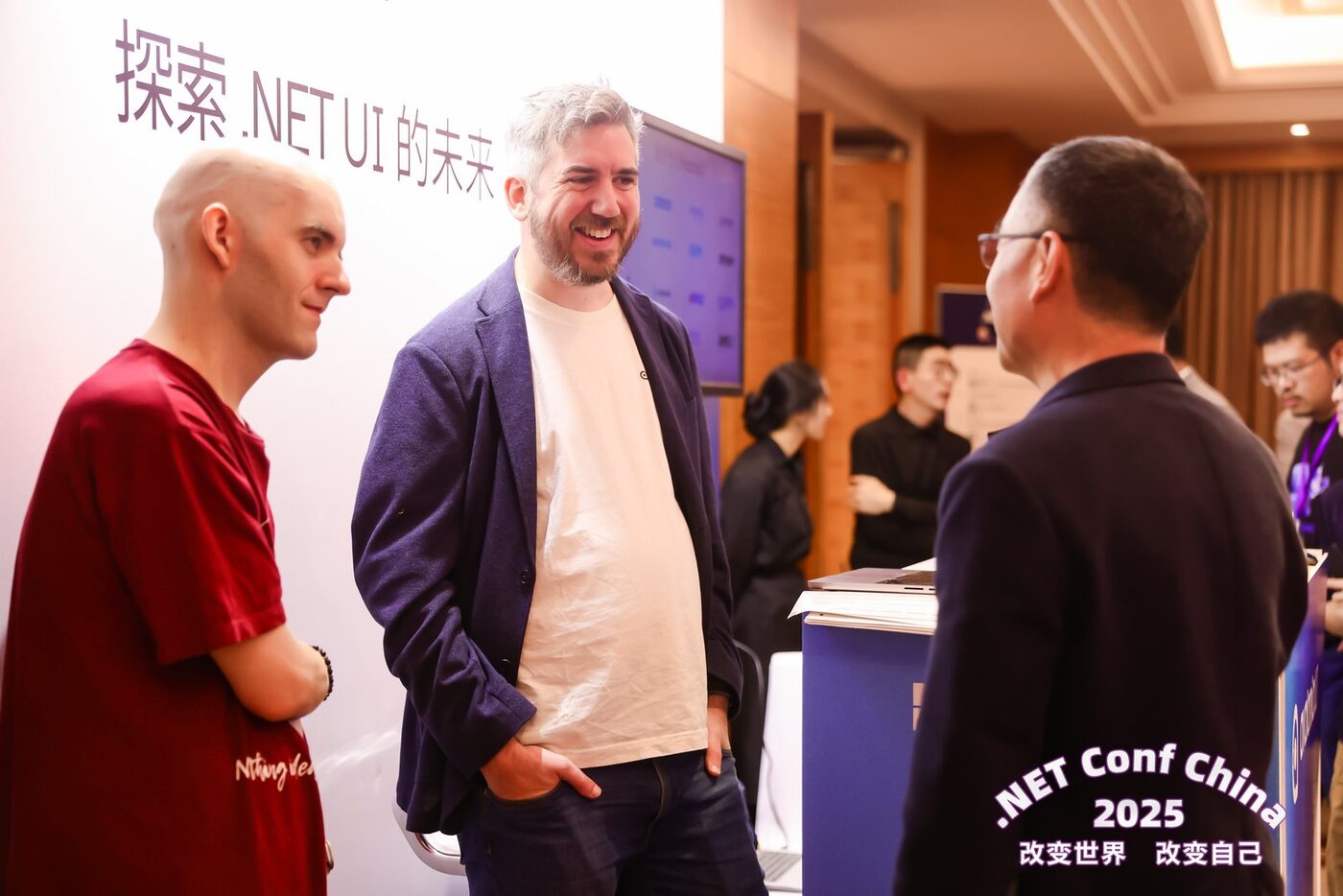 Two Avalonia team members in conversation with an attendee at .NET Conf China 2025